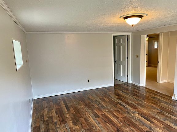Living room from the front door facing into kitchen and bedrooms