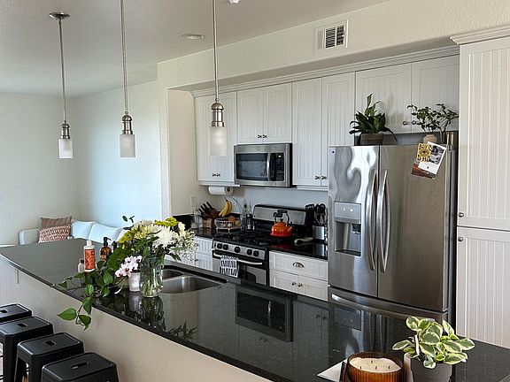 14-foot island, granite counter-tops, stainless-steel appliances, lots of storage.