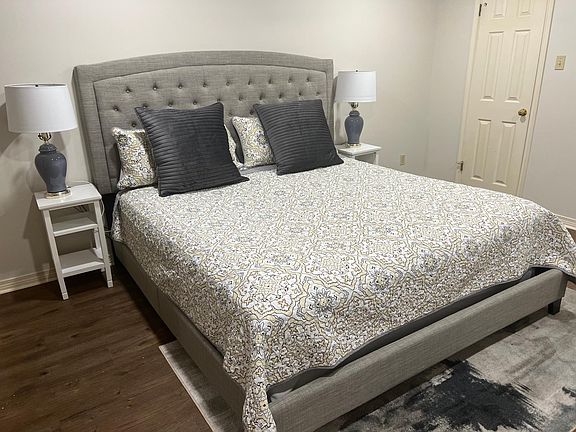 Down stairs bedroom with king sized bed; walk in closet to the right.