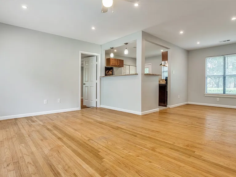 Living space is open to dining and kitchen.