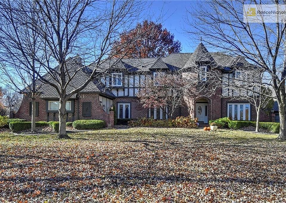 Absolutely Breathtaking Curb Appeal with Mature Landscaping and Tudor Style Exterior.