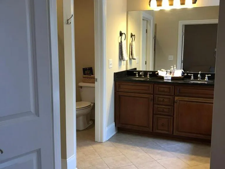 His & Her sinks with the privacy of a water closet
