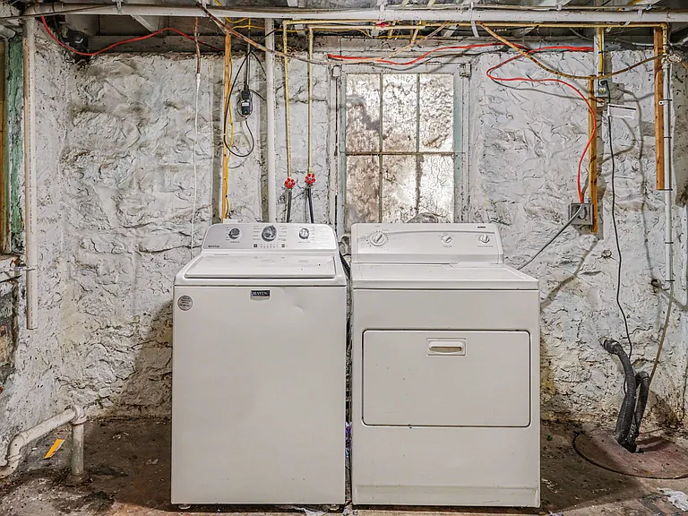Dedicated laundry area with full-size washer and dryer for convenient in-home laundry.