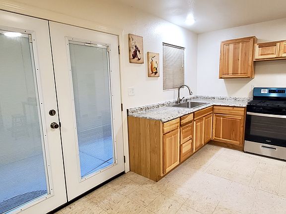 To the left of front entry is the kitchen