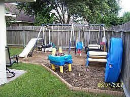 Corner of yard containing 8 inches of "kiddy cushion" for added protection