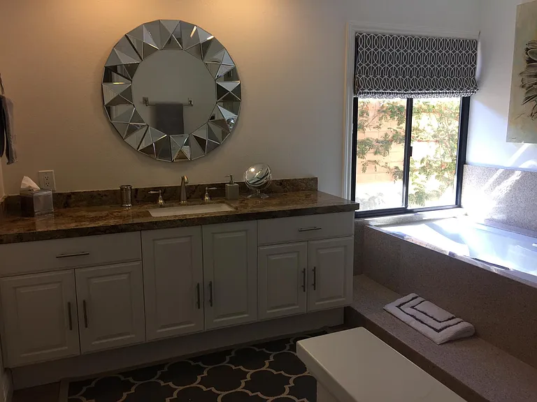 Primary bath, with two separate sink areas, soaking tub and stand up shower