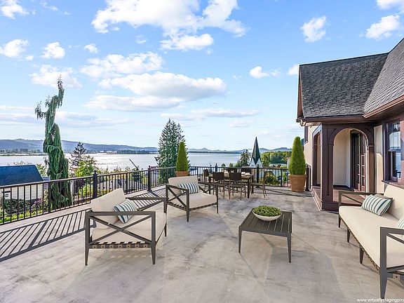 Expansive deck overlooks the Columbia River and Puget Island. Note: Deck virtually staged