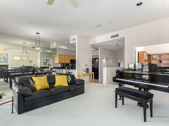 LOVELY LIGHT OPEN FLOOR PLAN/ LIVINGROOM AND DINING ROOM OVERLOOK POOL