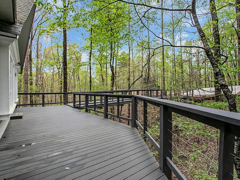 The porch has the most wonderful surrounding of trees which shades it during the summer.