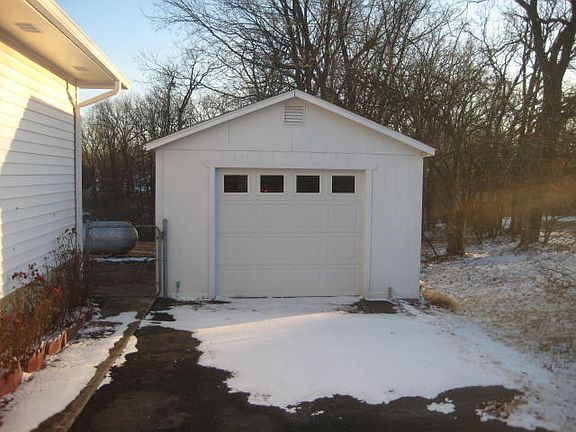 Detached garage-paved drive