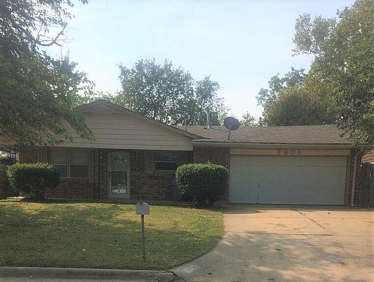 Street view of 7408 NW Woodland Drive.
