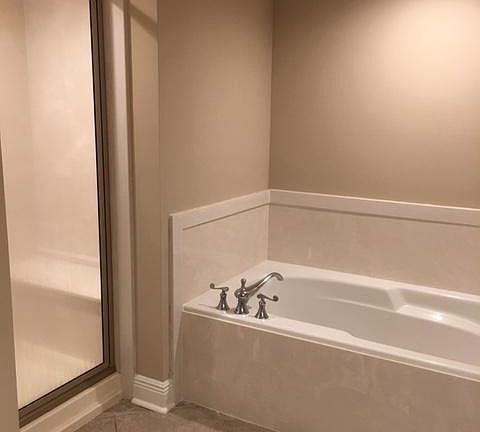 Soaker tub with stand alone shower