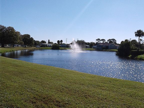 Lake Fountain looking  house