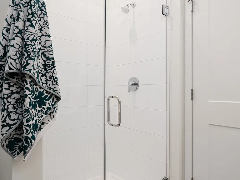 Glass-enclosed showers offer a spa-like feel for everyday comfort.