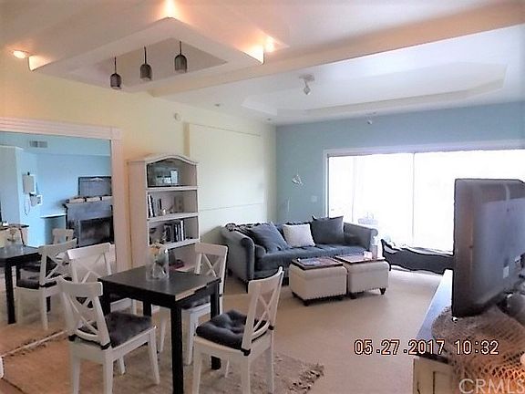 Living room with high sculptured ceilings