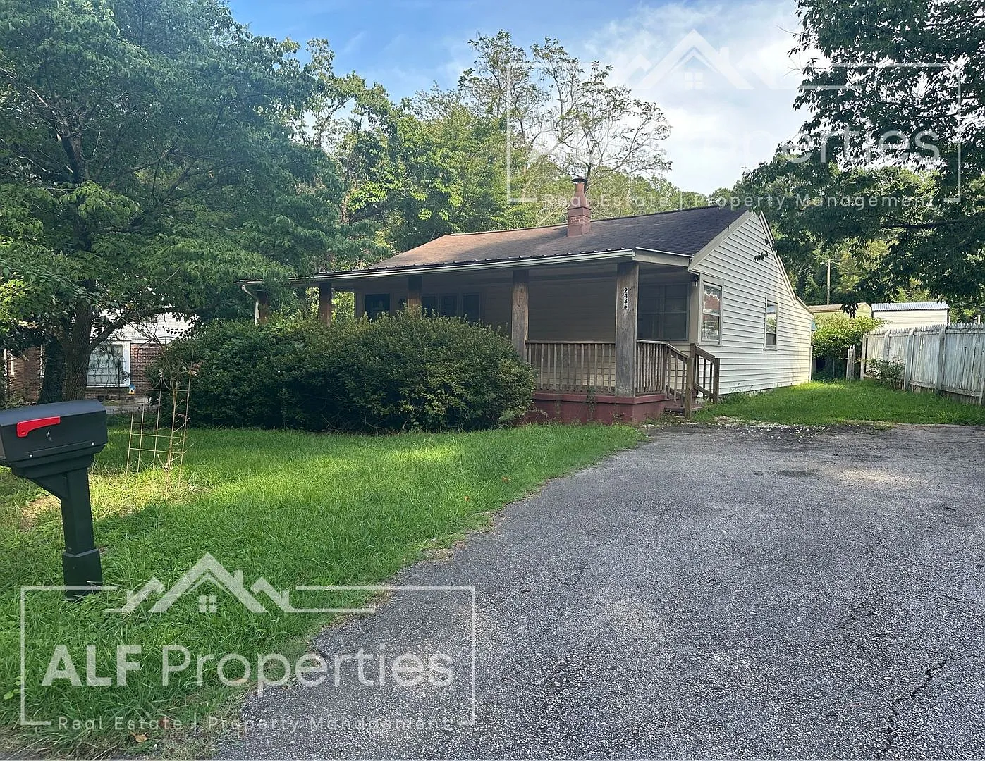 Charming 2-Bedroom Home with Bonus Sunroom, Covered Patio & Fenced Backyard — Photo 1