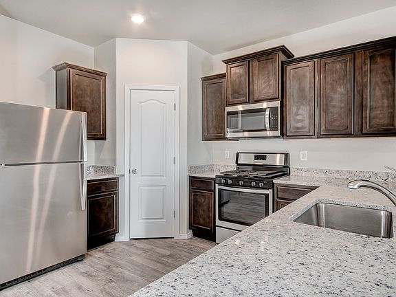 Stunning kitchen with a full suite of stainless appliances.