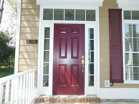 Entry - with Transom Windows on the top and sides of the Front Door.
