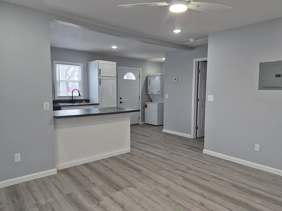 living room and door to bedroom