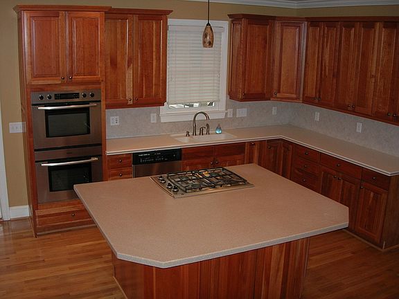 Open kitchen with high end Bosch appliances and custom cabinets