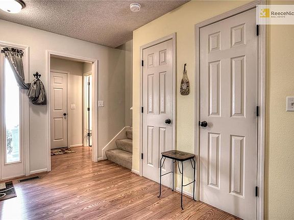 Laminate wood flooring begins at the front door and flows through out the main level