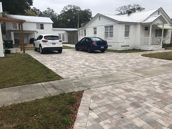 View of side of house,back door and off-street parking.