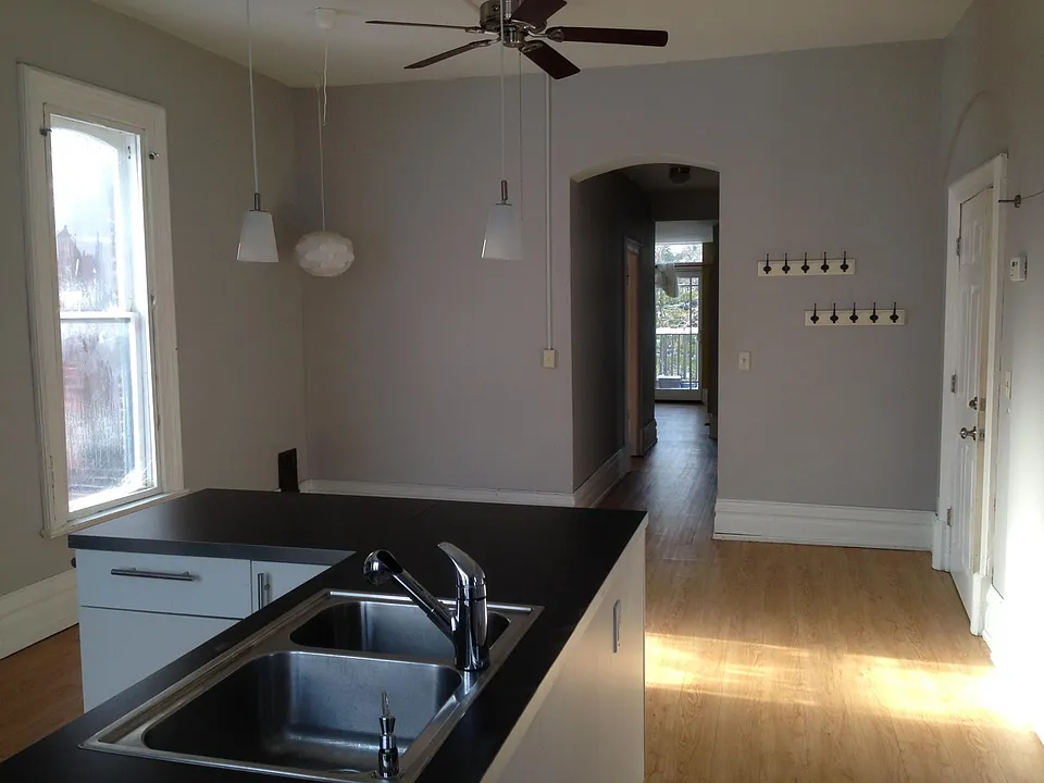 Spacious kitchen and dining room looking toward the family room with balcony