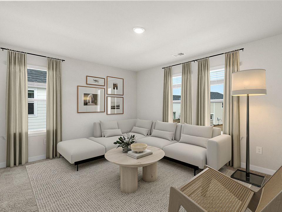 Upstairs, the loft makes the perfect media space or playroom.