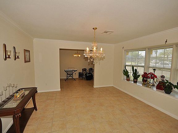 Formal dining room off of front entry. Beautiful bay window. All windows have shutters.