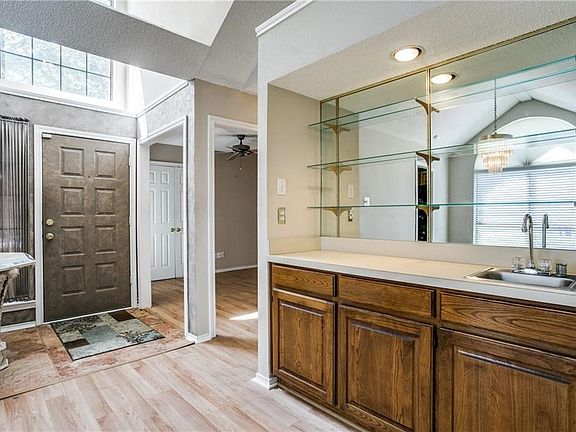 View back of front door and wet bar.