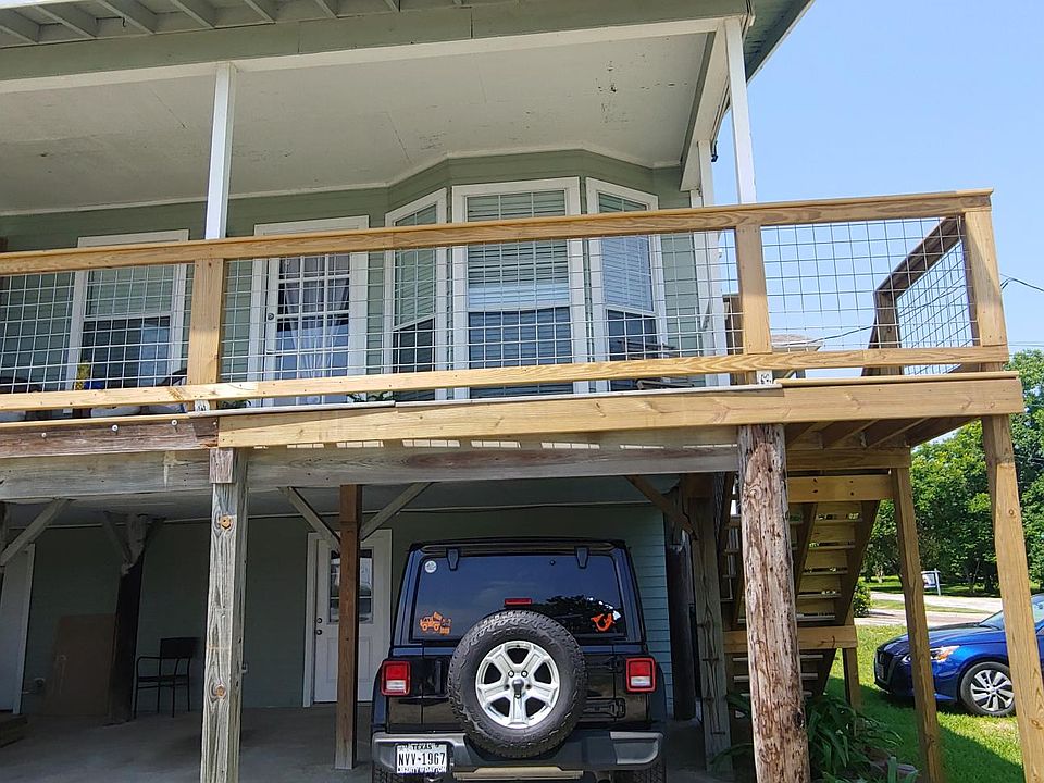 Front porch and two covered parking spots.
