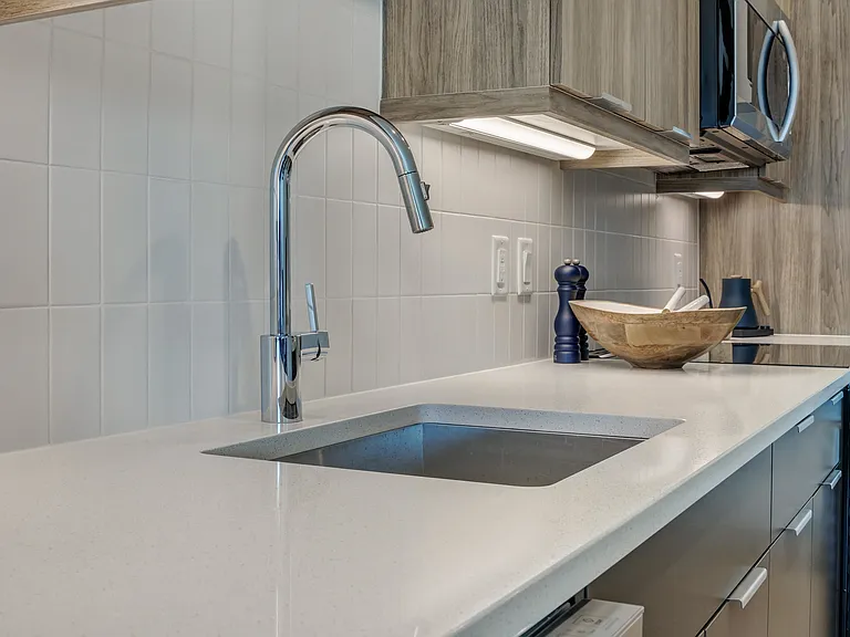 Check out our stunning kitchens with sleek wood-grain cabinetry and kitchen islands