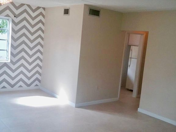 LIVING ROOM AREA WITH NEW TILE FLOORS