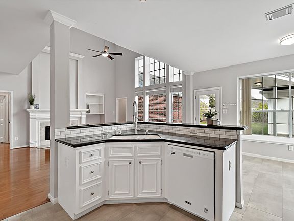 Open concept kitchen looks out to a spacious living room.
