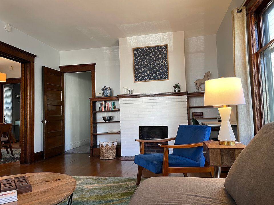 Mantel and book shelves in living room.