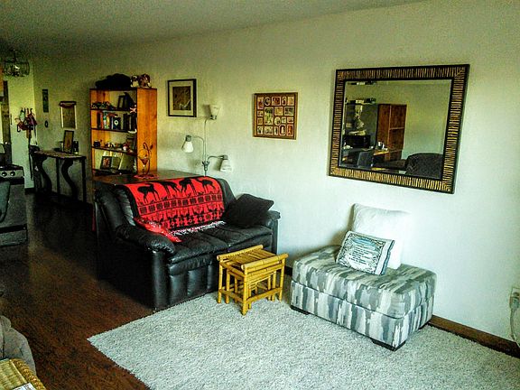 Living room area including big screen TV
