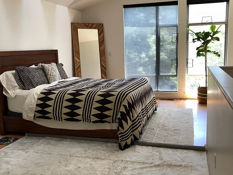 Same as previous picture. Now a view of the bedroom with furniture. Notice the shade in this picture is in the "shear mode" (furniture not included)