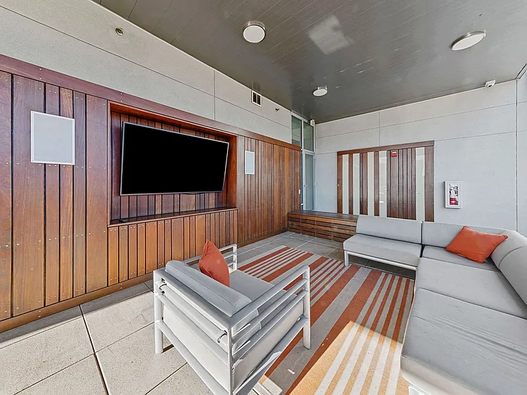 Outdoor seating plaza with TVs and more