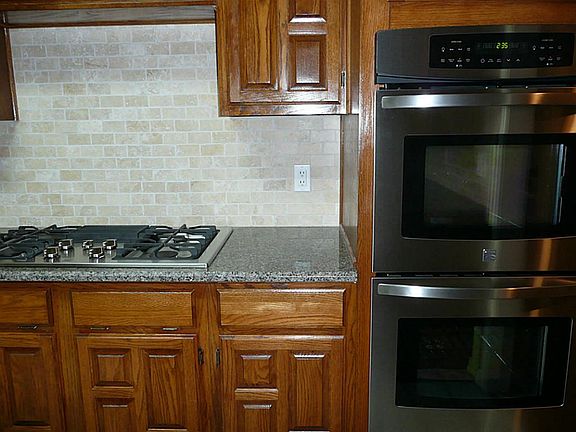 NEW STAINLESS STEEL DBL OVENS AND GAS RANGE FROM KENMORE ELITE.