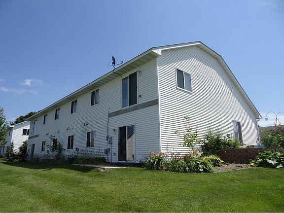 Backyard view.  Walkout lower level, ready to add a deck off living room, enjoy the side patio off dinette.