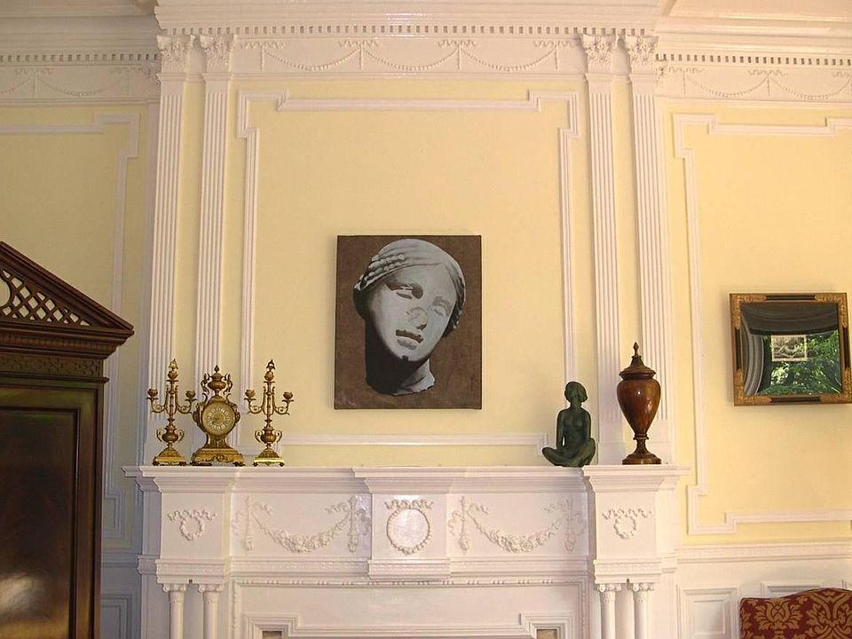 Elegant Fireplace & Corinthian column moldings. Note: Walls are no longer yellow & have been re-painted in more neutral color. (See photo #2).