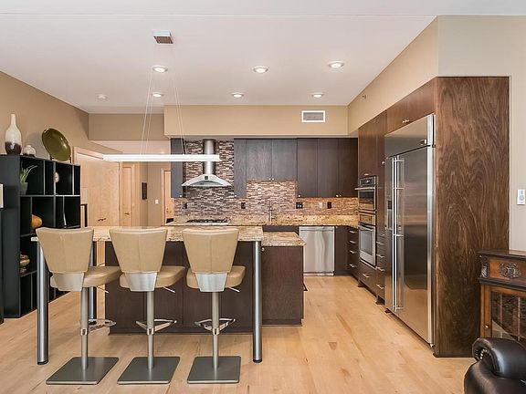 This home features a custom glass back splash, unique lighting.