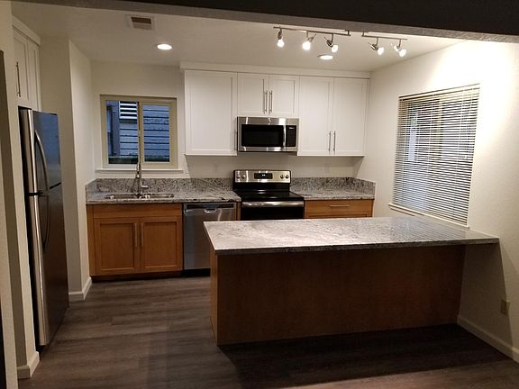 3 year old stainless steel all electric kitchen. Plenty of cabinet storage and room for multiple chefs. Open floor plan that blends seamlessly with the living room.