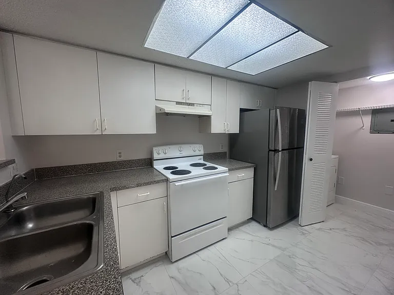 5011 Wiles Rd #207 — Photo 19