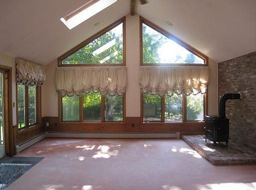 The sun-drenched cathedral ceiling family room. 