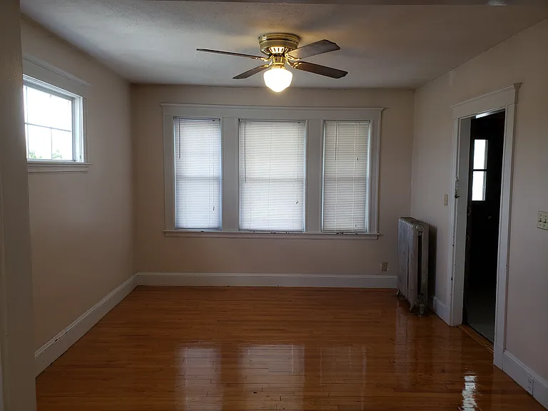 Living room with beautiful hardwood floor and ceiling fan