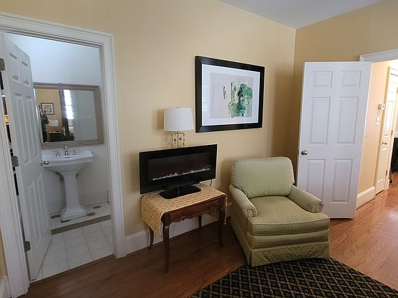 Large king bedroom with a sitting area. Hardwood floors thru out.