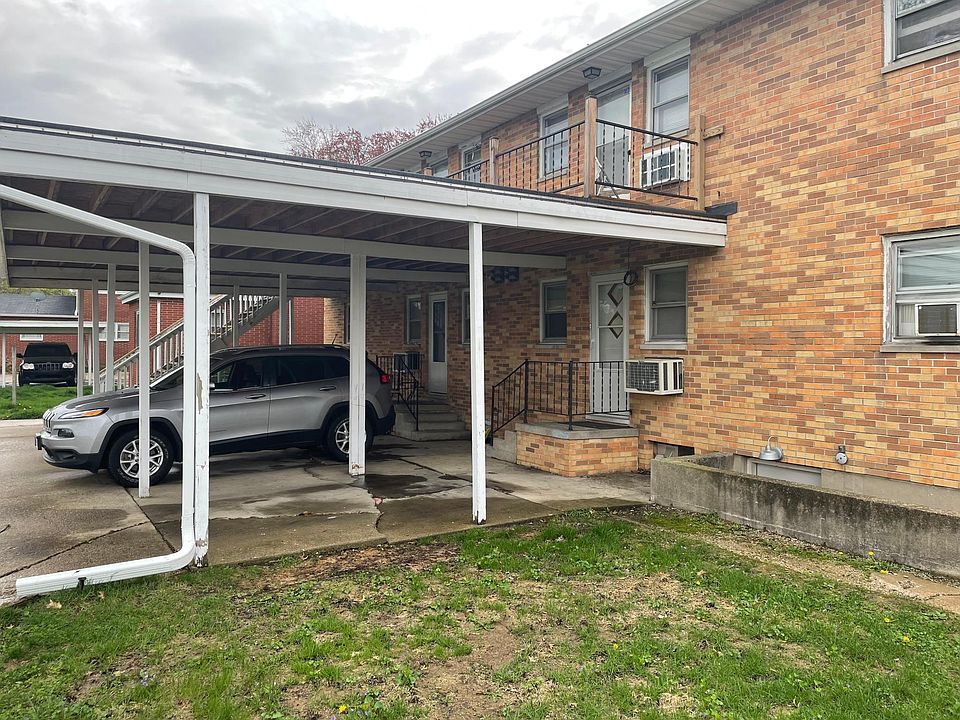 Carport in rear of building.