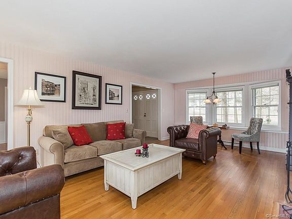 Hardwood floors and bay window grace the living room