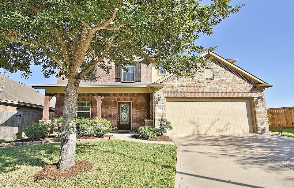 Welcome to your new home. Very pretty front elevation enhanced with brick and stone with wood detail on covered porch columns and shutters. Mature Oak tree in front and nice landscaping show pride of ownership.